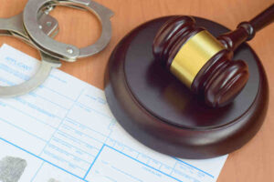 fingerprints card with police handcuffs