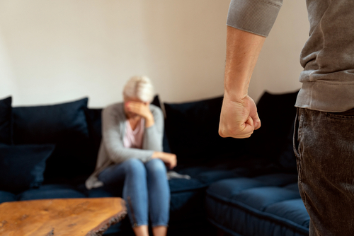 Aggravated assault attorney in Houston reviewing evidence in a domestic assault case involving threats or physical confrontation.